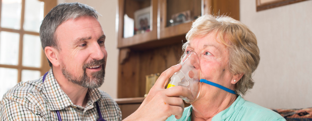 Care Worker Helping with Oxygen